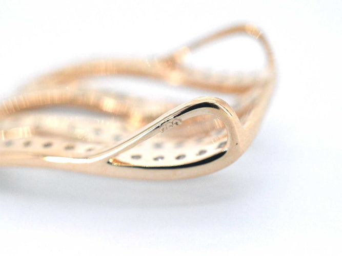 Pendentif Pendentif design en or rose avec diamants brillants blancs et noirs 58 Facettes 2245