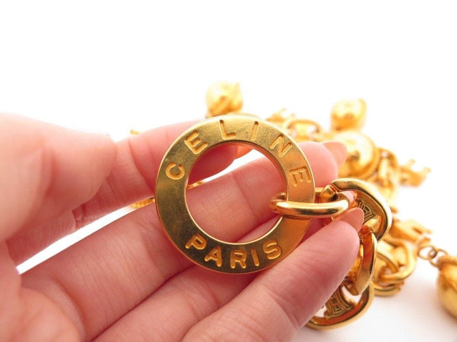 Collier vintage collier CELINE breloques arc de triomphe & spheres logo dore 58 Facettes 260608