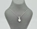 Collier Collier en or blanc avec perle et diamants 58 Facettes 10852