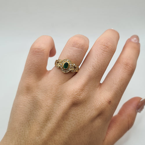 Bague 52 Bague or jaune sertie d'émeraudes et diamants 58 Facettes