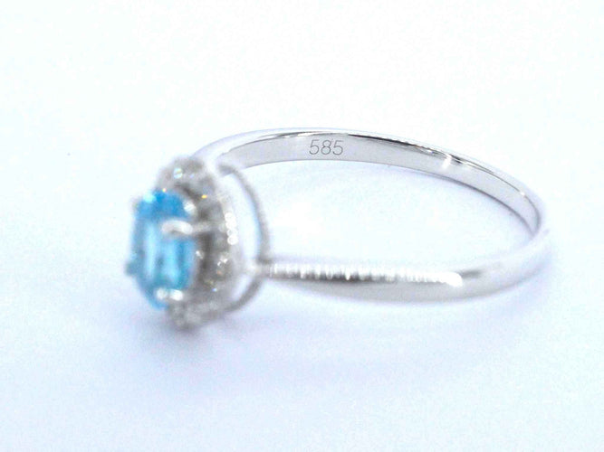 Bague Bague en or blanc avec une topaze bleue et des diamants naturels 58 Facettes 2367