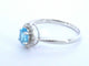 White gold ring with a blue topaz and natural diamonds 58 Facettes 2367