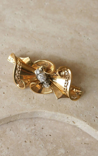 Broche Broche noeud or rose, platine et diamants 58 Facettes