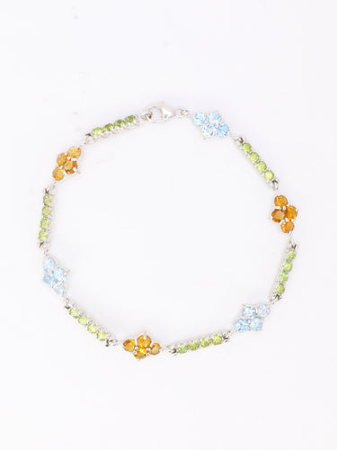 Bracelet Bracelet ligne or blanc citrines péridots topazes bleues 58 Facettes 1CA0000006/1
