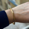 Bracelet Bracelet jonc ouvrant grand modèle en or jaune 18k 58 Facettes