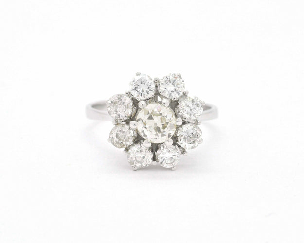 Bague Bague avec diamant central et contour 58 Facettes