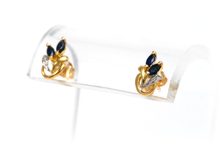 Boucles d'oreilles Boucles d'oreilles contemporaines en or jaune et blanc 18 carats serties de saphirs 58 Facettes 22580