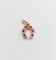 Pendentif Pendentif fer à cheval or rose, diamants et rubis (circa 1900) 58 Facettes A06034