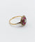 Bague 48 Bague fleur art deco or rose 18k ornée d'un diamant taille brillant entouré de rubis calibrés dans une monture finement travaillée (circa 1920) 58 Facettes A04432