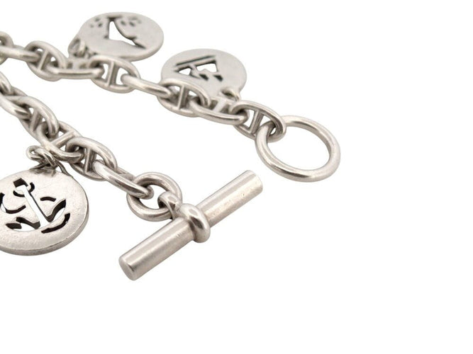 Bracelet vintage bracelet HERMES chaine d'ancre breloques marines t16 en argent 925 58 Facettes 267839
