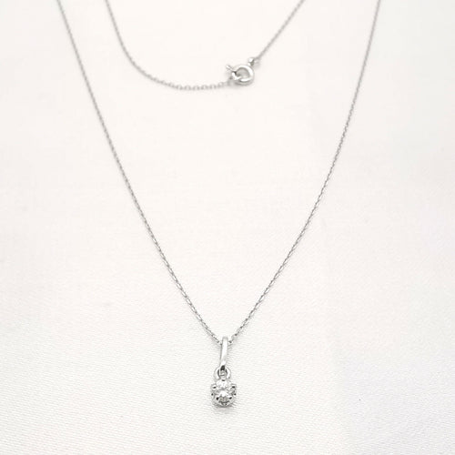 Collier Collier en or blanc serti d'un diamant de 0.15 carat 58 Facettes