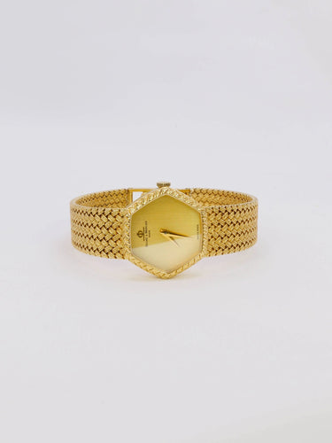 Montre BAUME & MERCIER - Montre vintage or jaune maille tressée 58 Facettes 1067.3