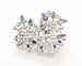 Broche Broche en or blanc avec diamants et saphirs 58 Facettes