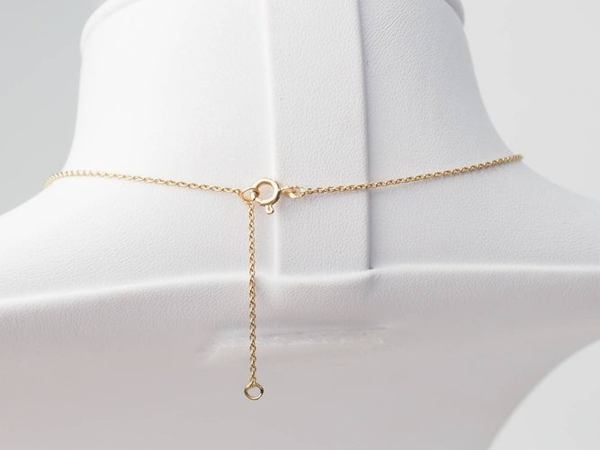 Collier Collier volutes en or jaune et argent, grenat diamants et perle 58 Facettes 33049