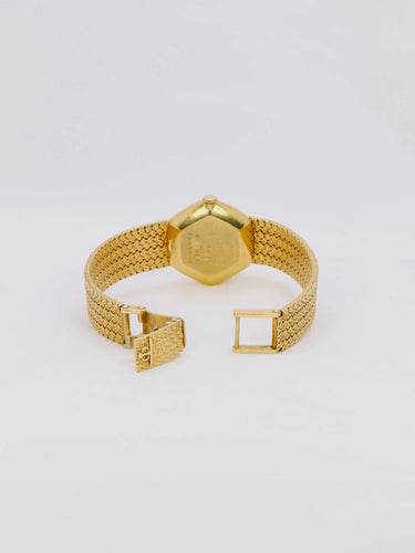 Montre BAUME & MERCIER - Montre vintage or jaune maille tressée 58 Facettes 1067.3