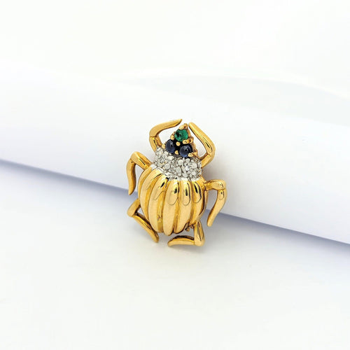 Broche Broche Animalier or jaune émeraude et saphirs 58 Facettes 27221