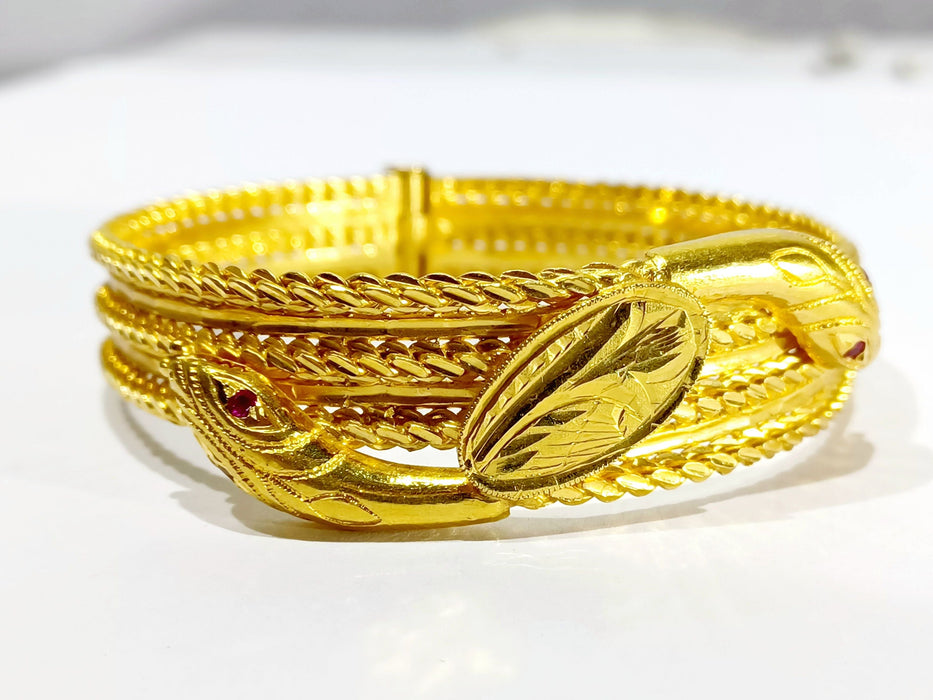 Bracelet Bracelet serpent or jaune et rubis 58 Facettes