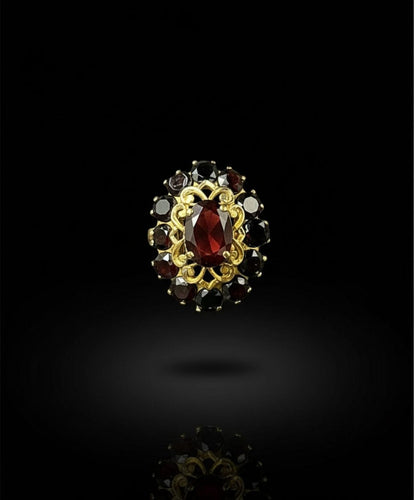 Bague Bague majestueuse en grenat pyrope 58 Facettes