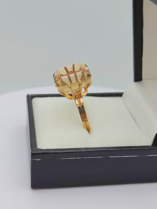 Gold cocktail ring adorned with a citrine