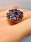 54 Importante bague or jaune, 7 saphirs et 6 rubis 58 Facettes AB454