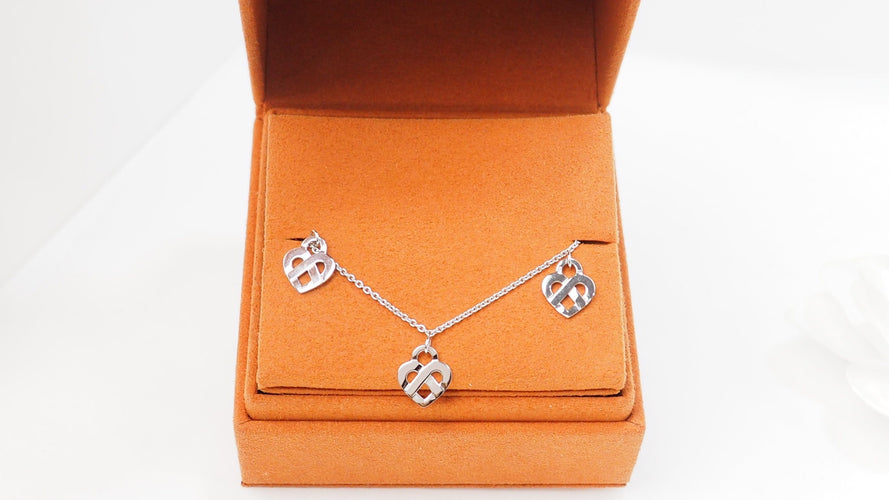 Bracelet Bracelet Poiray Coeur Entrelacé en or blanc 58 Facettes 32973