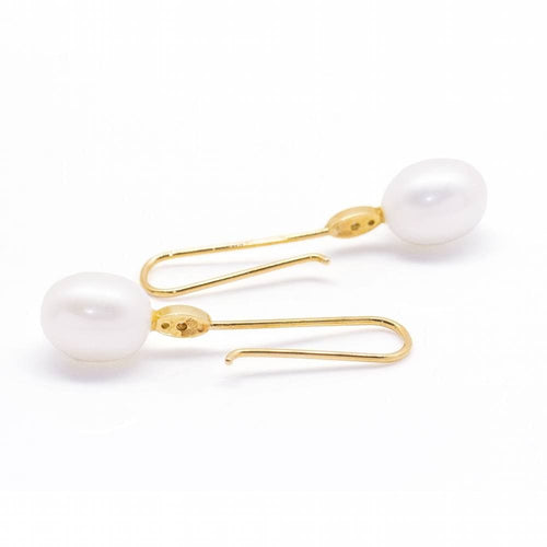 Boucles d'oreilles Boucles d'oreilles avec perle ovale et diamant 58 Facettes D360904FV