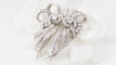 Broche Broche Art déco double clips en or blanc et platine, diamants 58 Facettes 32946