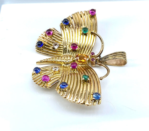 Pendente a farfalla in oro giallo e pietre preziose 