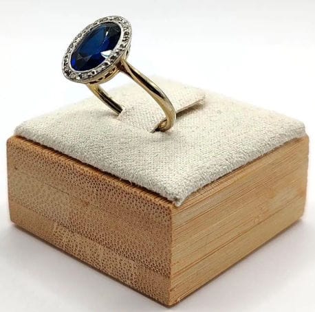 Bague 50.5 Bague Pompadour deux ors ornée d'une pierre bleue et de diamants 58 Facettes