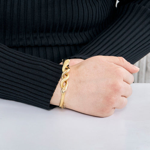 Bracelet Bracelet jonc motif serpent en or jaune et rubis 58 Facettes ROD3486