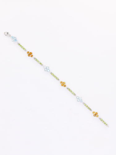 Bracelet Bracelet ligne or blanc citrines péridots topazes bleues 58 Facettes 1CA0000006/1