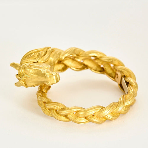 HERMES - Pulseira rígida em ouro amarelo com motivo de cavalo 