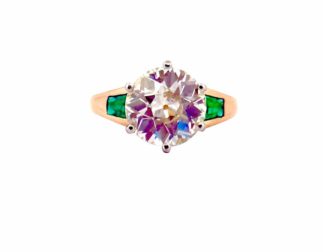 Bague 52 Solitaire en or et platine , diamant 3,85 carats , émeraudes 58 Facettes