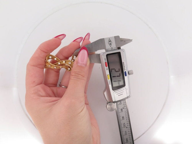 Broche vintage broche noeud sertie de 15 diamants 1.3 ct or jaune 58 Facettes 264002