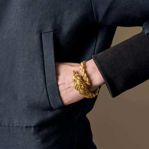 HERMES - Pulseira rígida em ouro amarelo com motivo de cavalo 