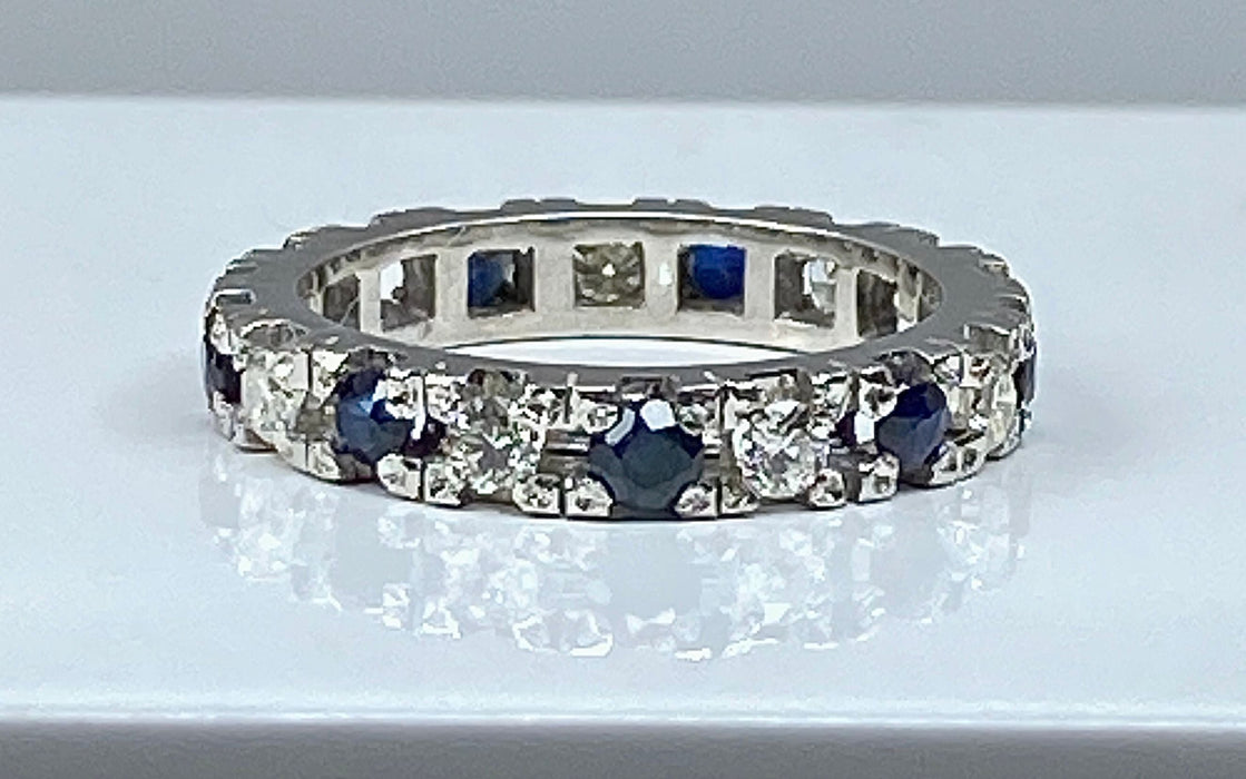 White gold wedding ring with 9 sapphires and 9 diamonds