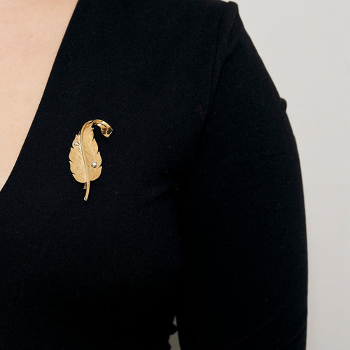 Broche Broche plume or jaune et diamant 58 Facettes SQU3218