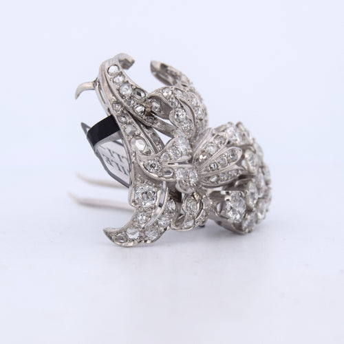 Broche Broche ancienne en or blanc 18 carats 58 Facettes