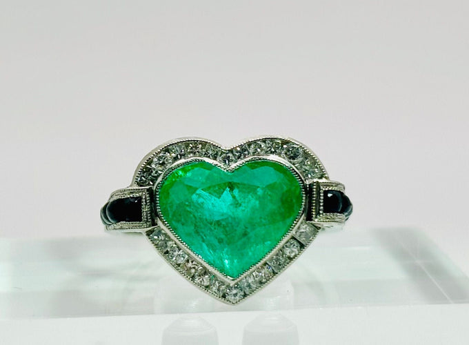 Bague 53 Bague en platine avec une émeraude, des diamants et de l'onyx 58 Facettes 50280