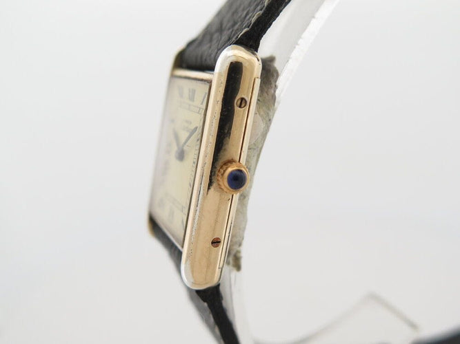 Montre vintage montre must de CARTIER tank 30 mm mecanique vermeil dore en 58 Facettes 266183