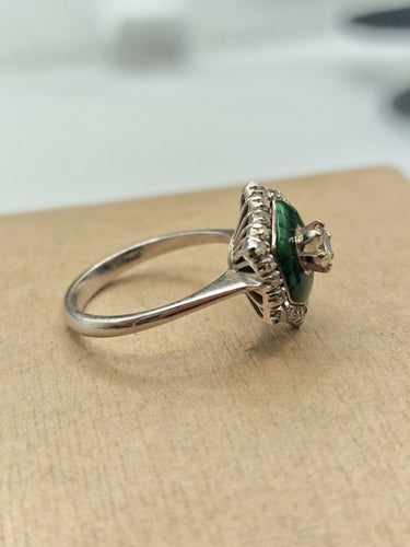 Bague 55 Bague solitaire en or blanc et émail, ornée d'un diamant. 58 Facettes