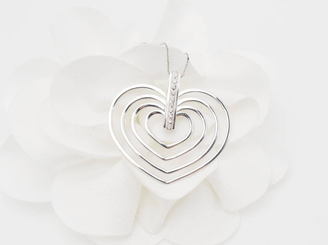 Collier Collier en or blanc et 4 coeurs 58 Facettes 26383