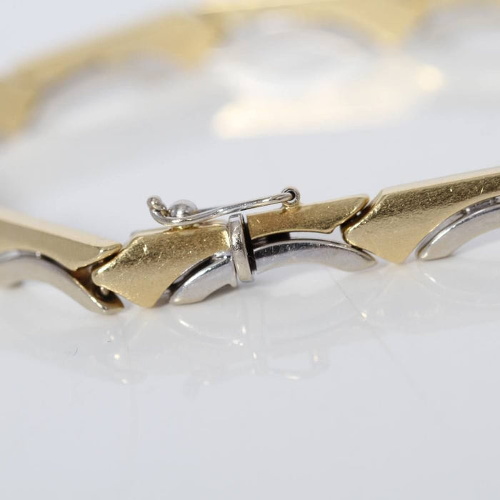 Bracelet Bracelet en or bicolore avec vague 58 Facettes E361321B