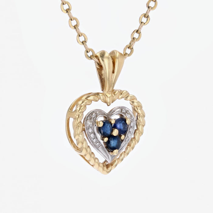 Pendentif Pendentif coeur ors jaune et blanc saphir d'occasion 58 Facettes 15-036