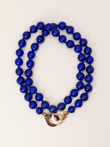 Collier DINH VAN Collier menottes R15 or jaune lapis lazuli 58 Facettes 1204.6
