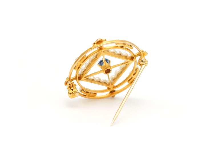 Broche Broche en or jaune sertie d'un saphir et de perles 58 Facettes 22301