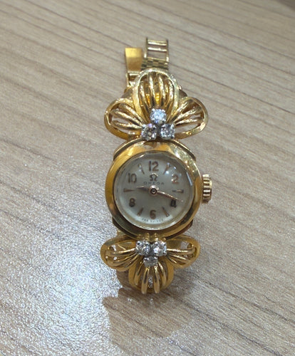 Montre Montre femme Omega vintage en or et diamants 58 Facettes