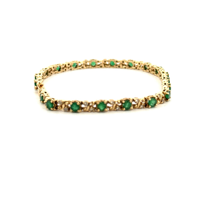 Rivière-Armband aus Gelbgold, Diamanten und Smaragden