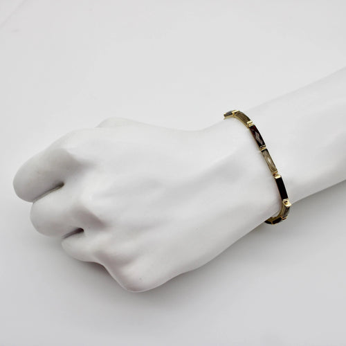 Montre Bracelet vintage en or 14 carats avec grenat et quartz fumé 58 Facettes A2000P