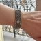 Bracelet Bracelet manchette tissé or gris 58 Facettes REF24086-249